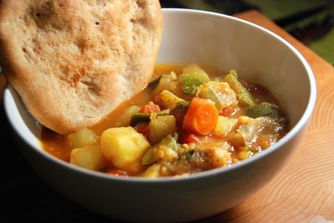 a bowl of bread and veggies